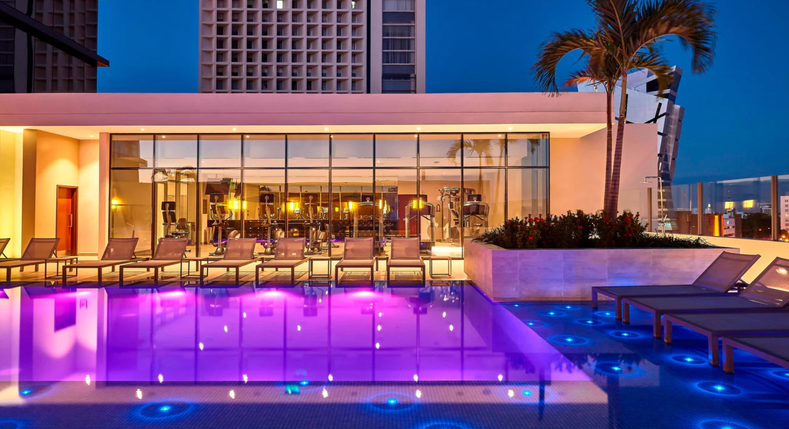 Marriott Santa Cruz rooftop pool illuminated at night, Bolivia