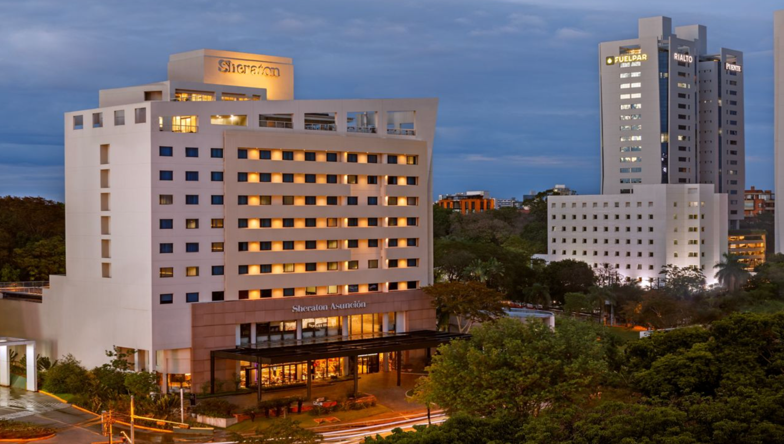Sheraton Asunción hotel exterior at night with city skyline, Paraguay