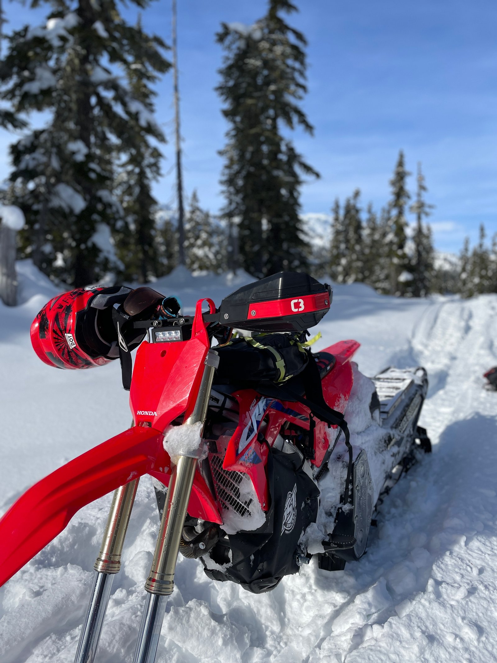 Honda snow bike winter forest close up