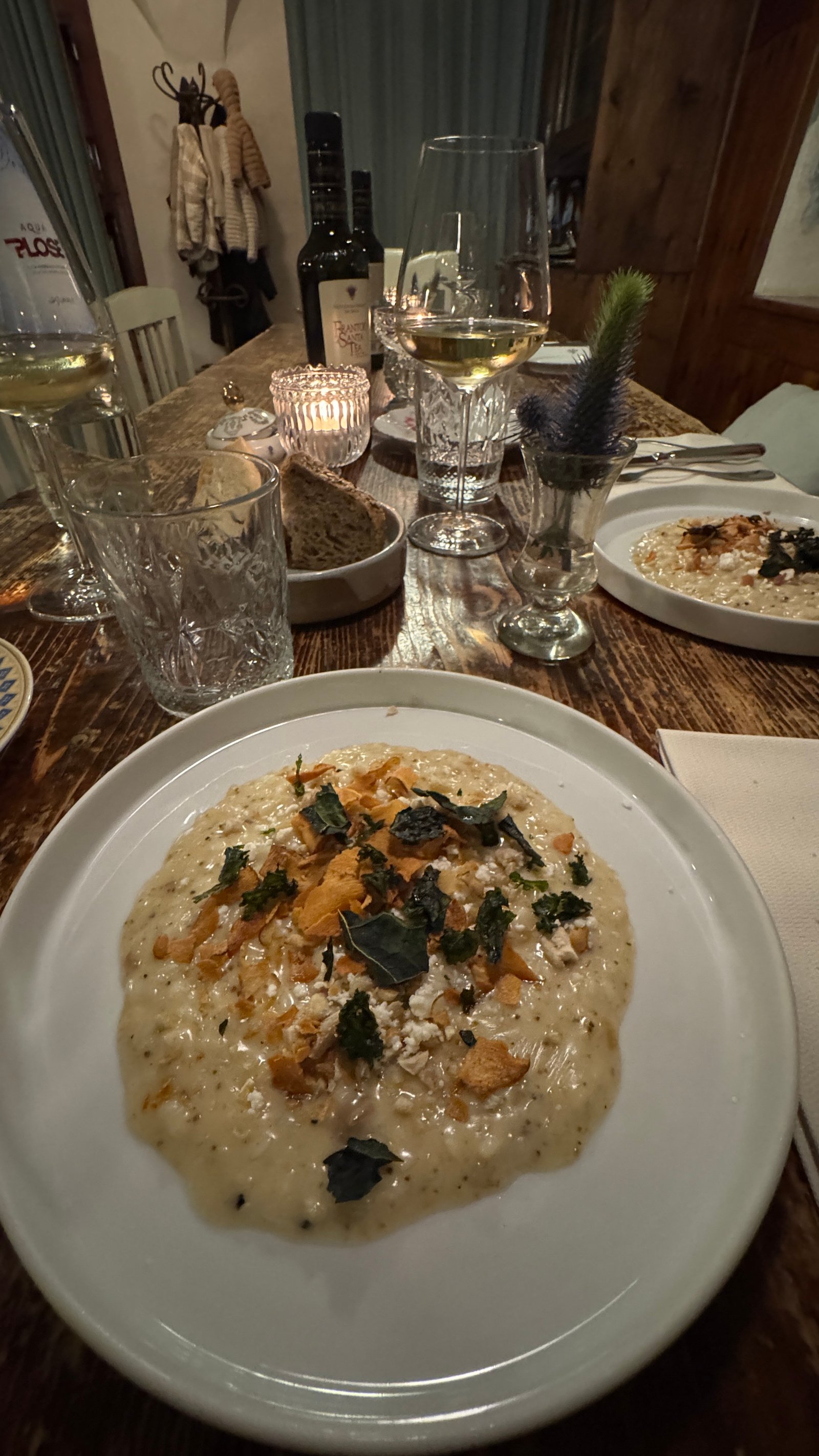 1477 Reichhalter Lana risotto with crispy elements on candlelit table