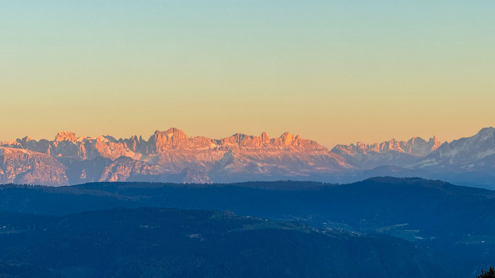 Rosengarten Dolomites at alpenglow golden hour viewed from Vigiljoch, South Tyrol