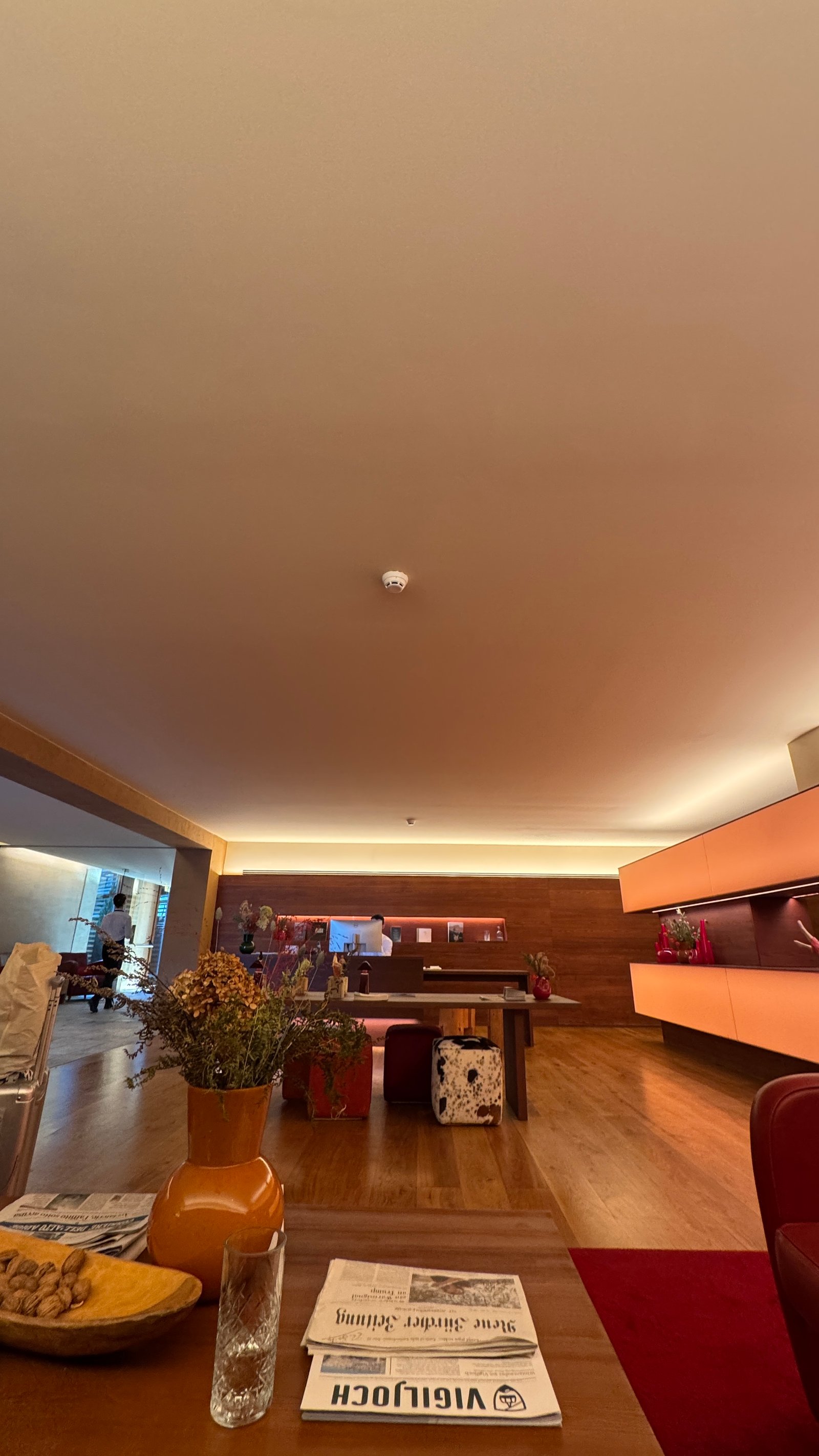 Vigilius Mountain Resort lobby warm interior with oak joinery and dried flowers