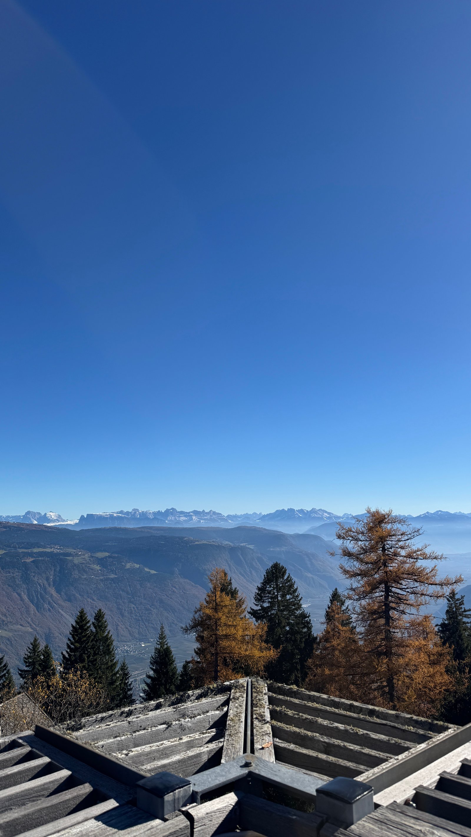 Vigilius Mountain Resort spa terrace with Dolomites view under blue sky